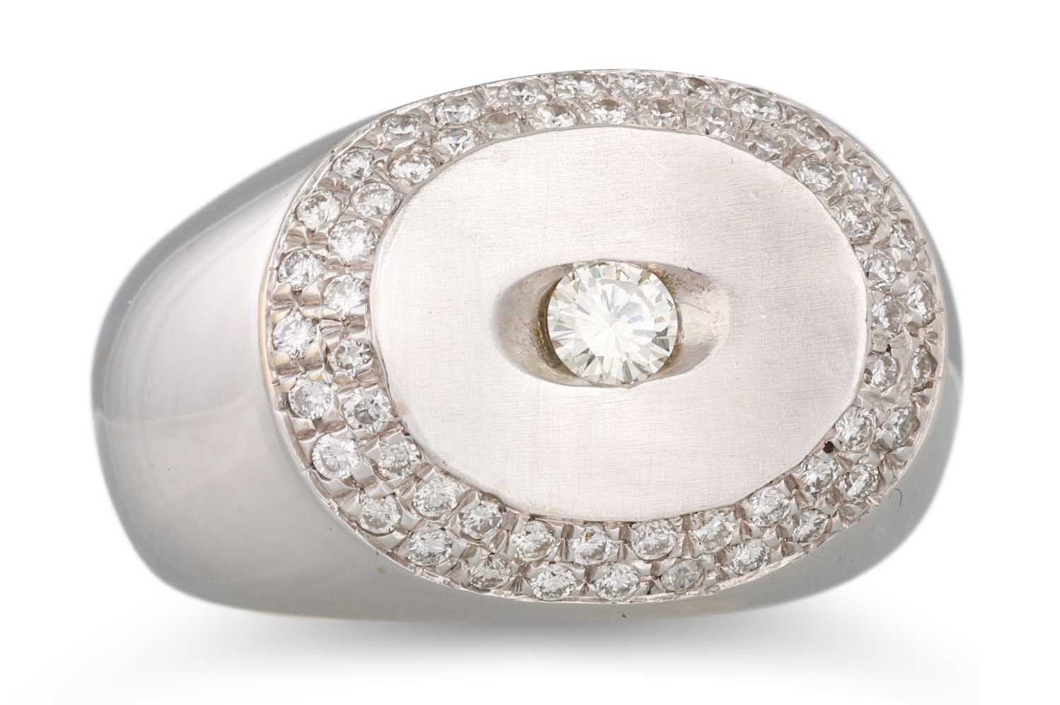 Lot 56 - A DIAMOND RING, of bombé form, the central...