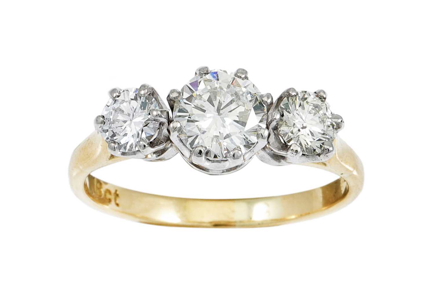 Lot 3 - A THREE STONE DIAMOND RING, the brilliant cut...
