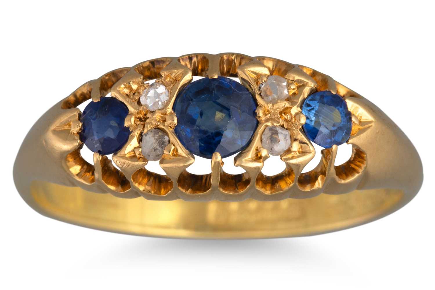 Lot 56 - A SAPPHIRE AND DIAMOND RING, the three row...