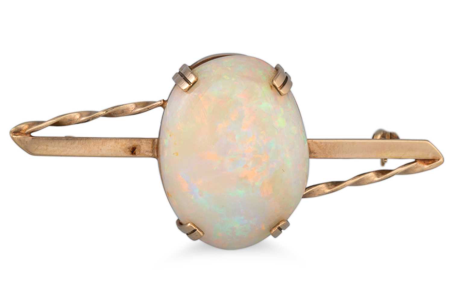 Lot 129 - AN OPAL SET BAR BROOCH, mounted in 9ct gold