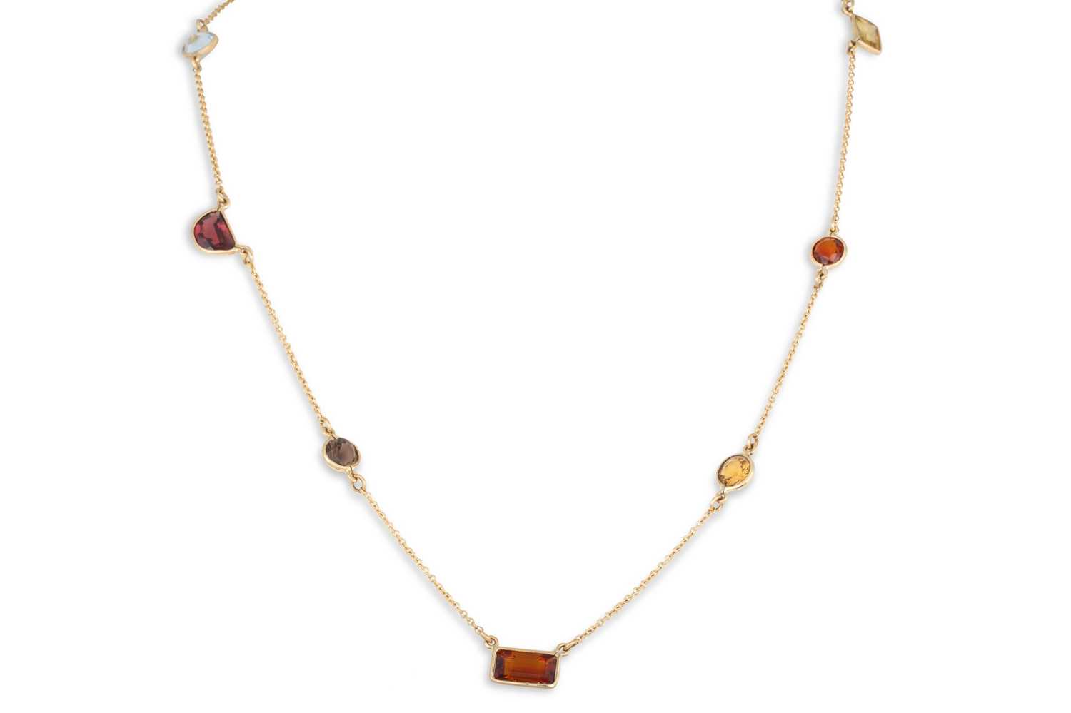 Lot 185 - A CITRINE, TOURMALINE, GARNET AND SMOKY QUARTZ...