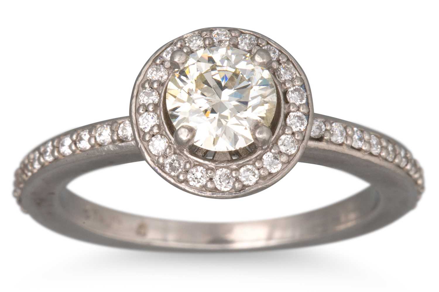 Lot 92 - A DIAMOND HALO CLUSTER RING, the round cut...