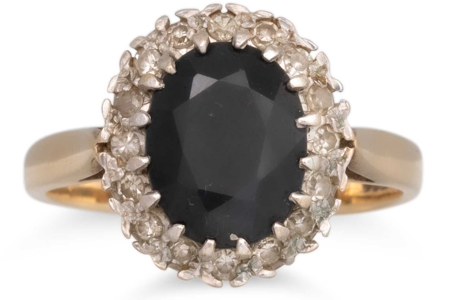 Lot 60 - A SAPPHIRE AND DIAMOND RING, the oval sapphire...