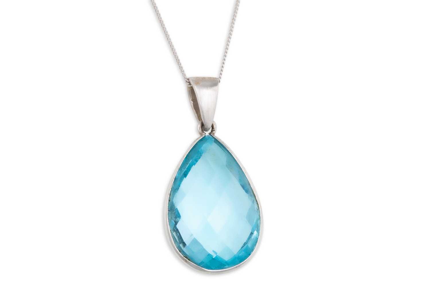 Lot 78 - A TOPAZ PENDANT, the pear shaped topaz mounted...