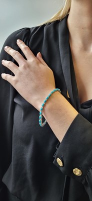 Lot 88 - A TURQUOISE AND DIAMOND LINE BRACELET, mounted...