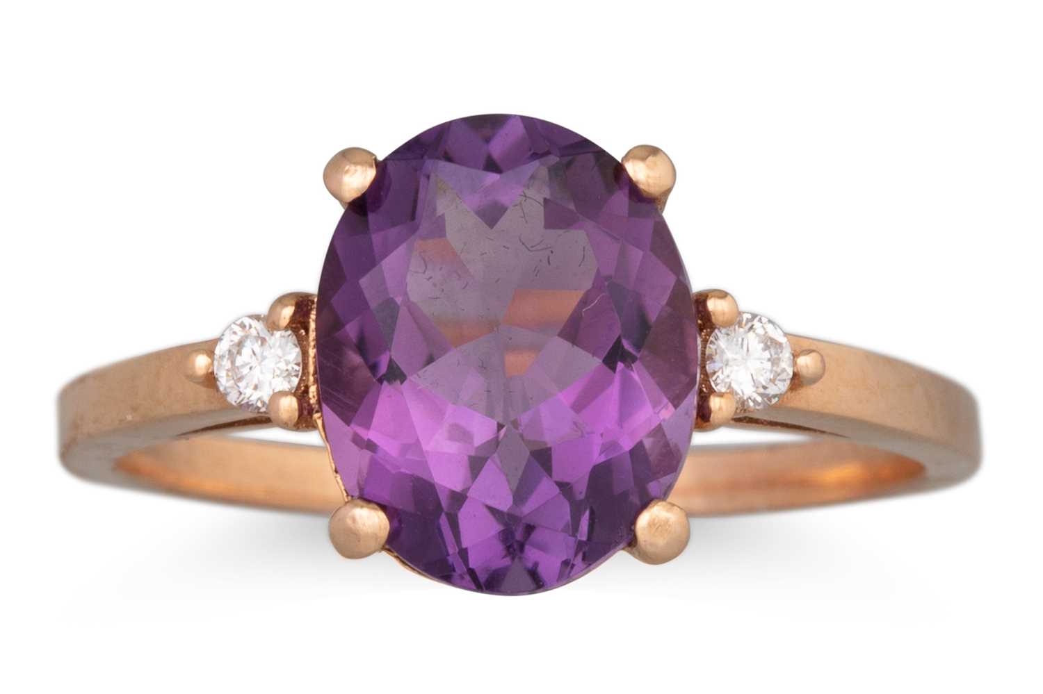Lot 97 - AN AMETHYST AND DIAMOND RING, the oval...