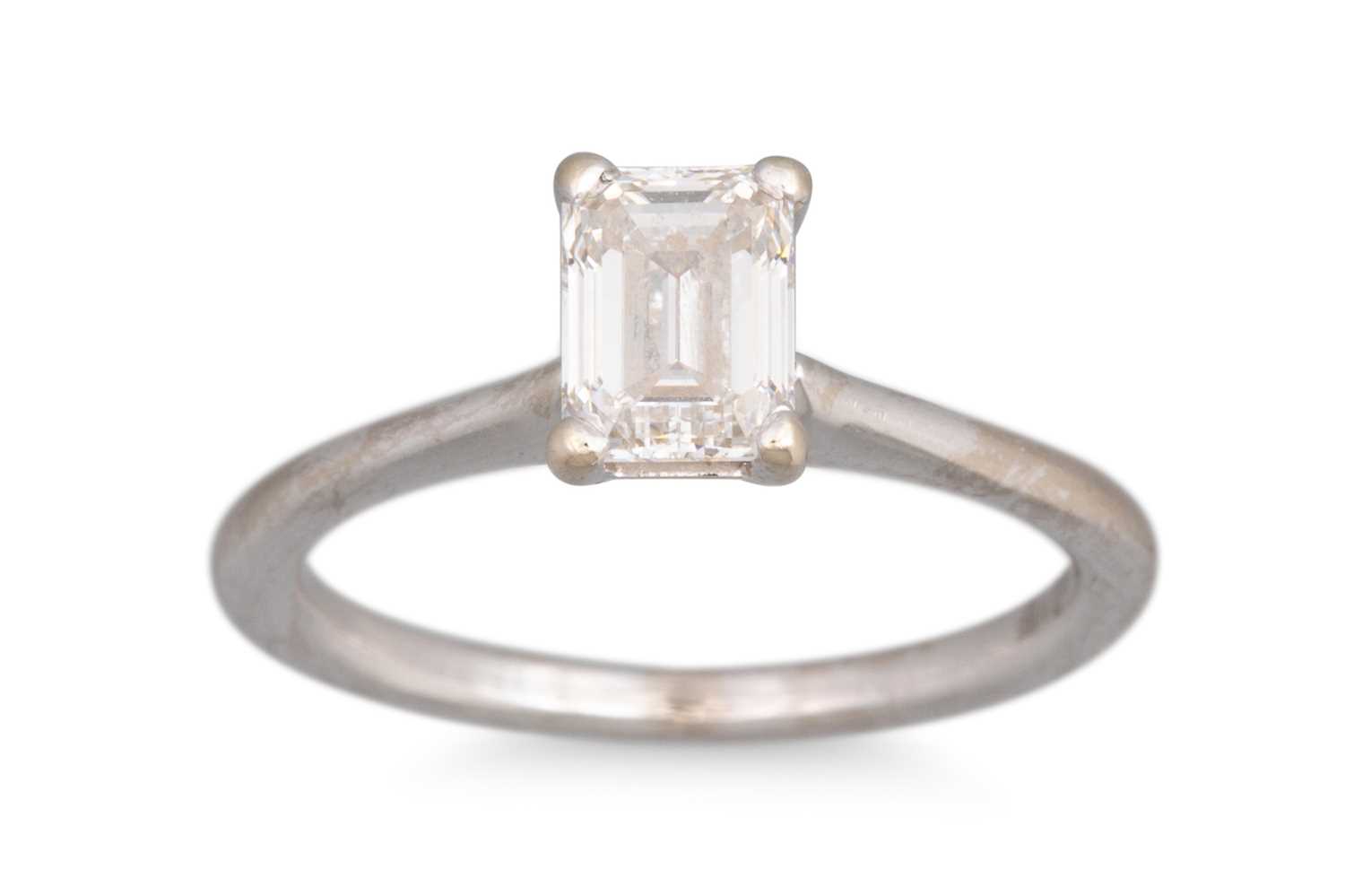 Lot 325 - A DIAMOND SOLITAIRE RING, the emerald cut...
