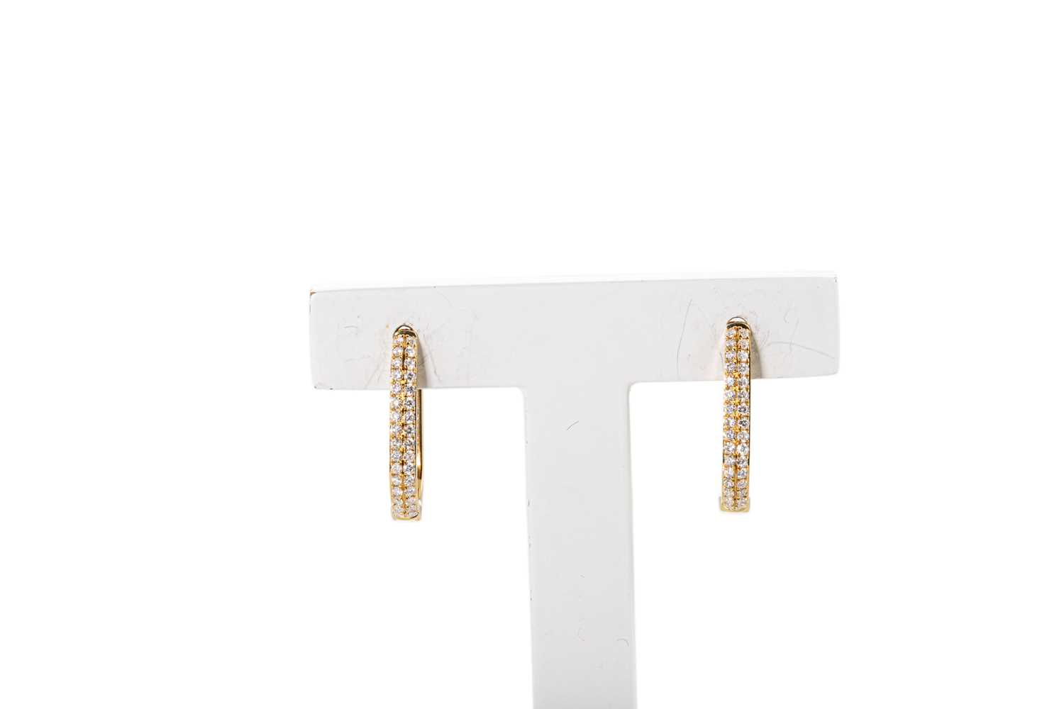 Lot 63 - A PAIR OF DIAMOND HOOP EARRINGS, pavé set with...