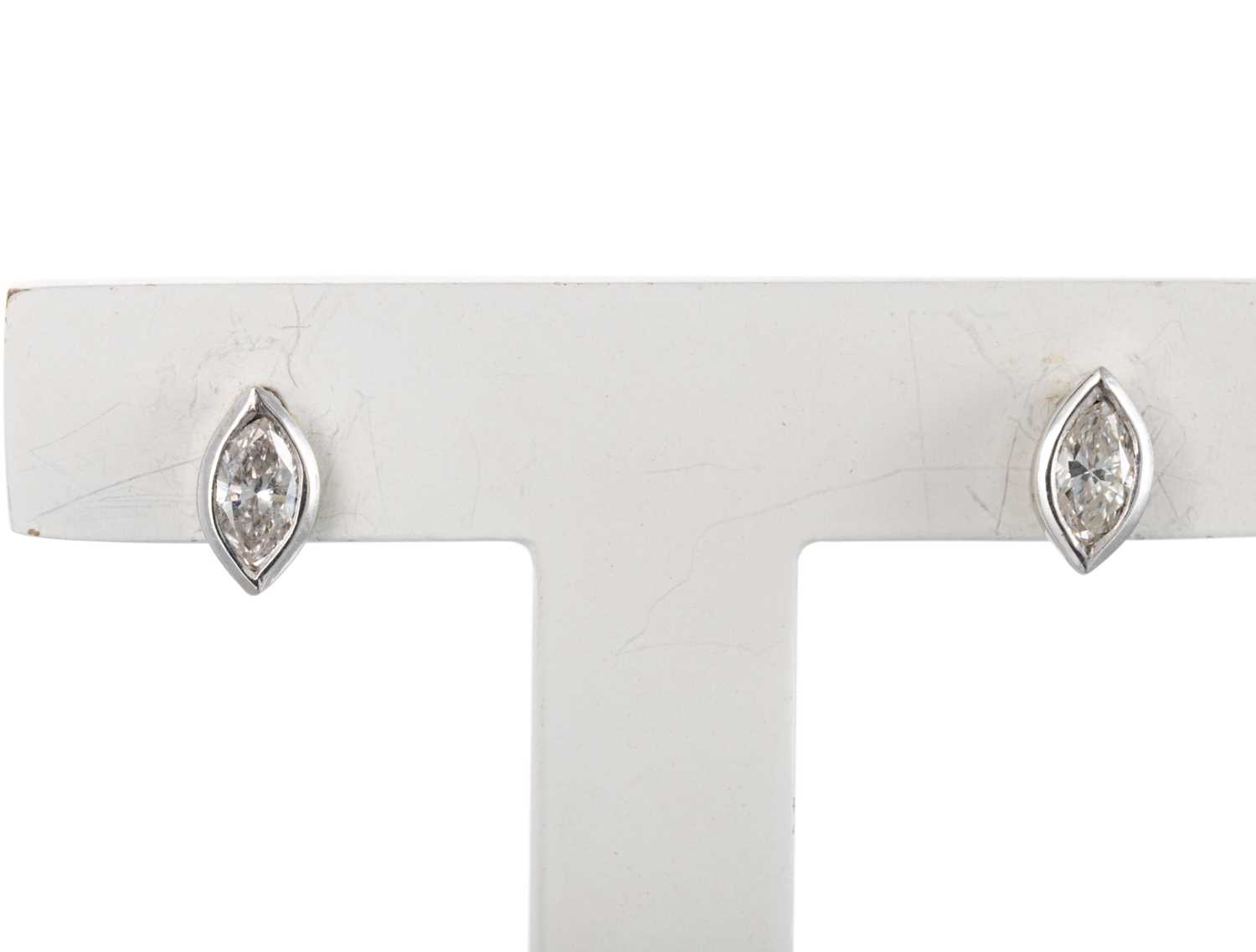 Lot 210 - A PAIR OF MARQUISE SET STUD EARRINGS, collet...