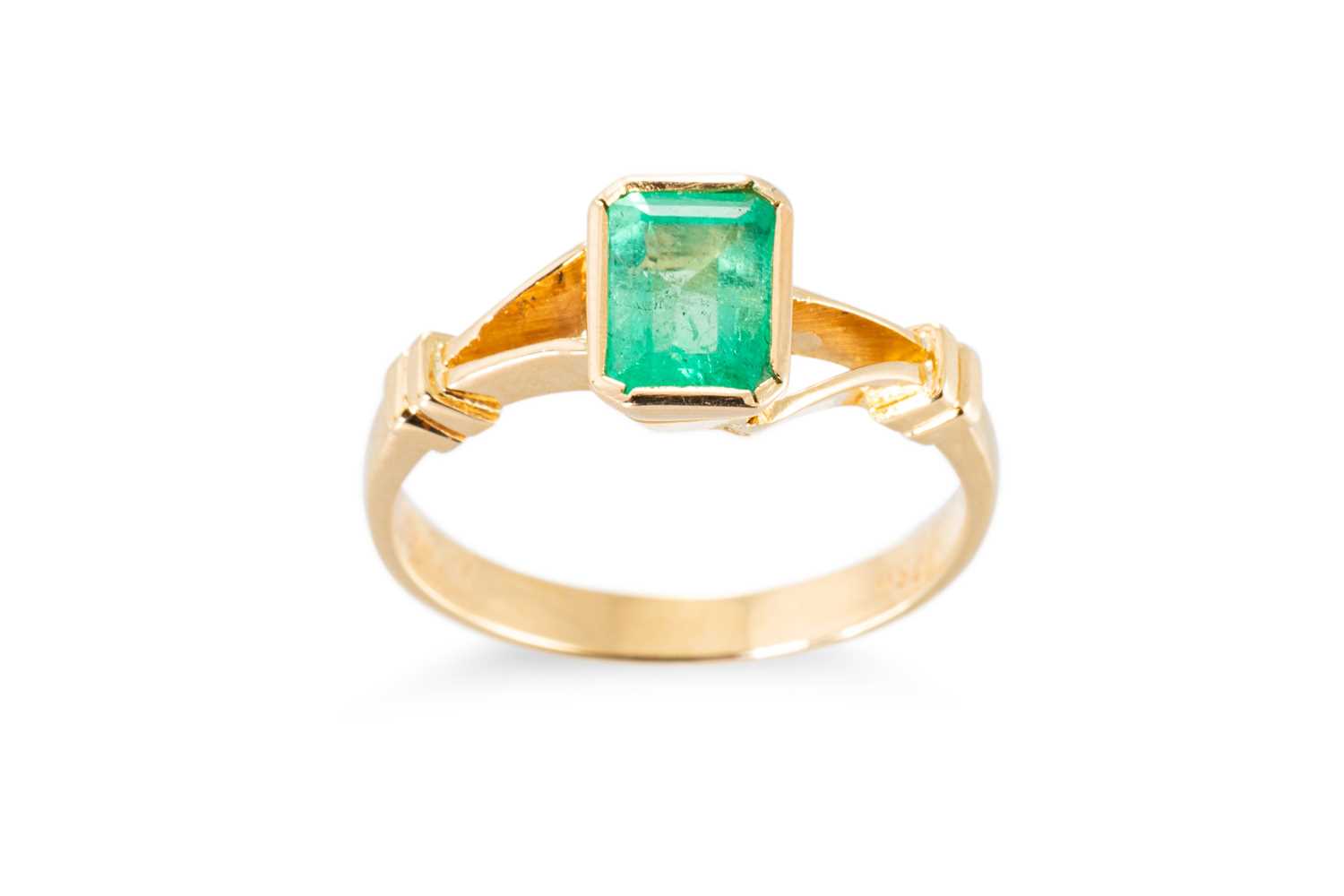 Lot 57 - AN EMERALD SINGLE STONE RING, the emerald cut...