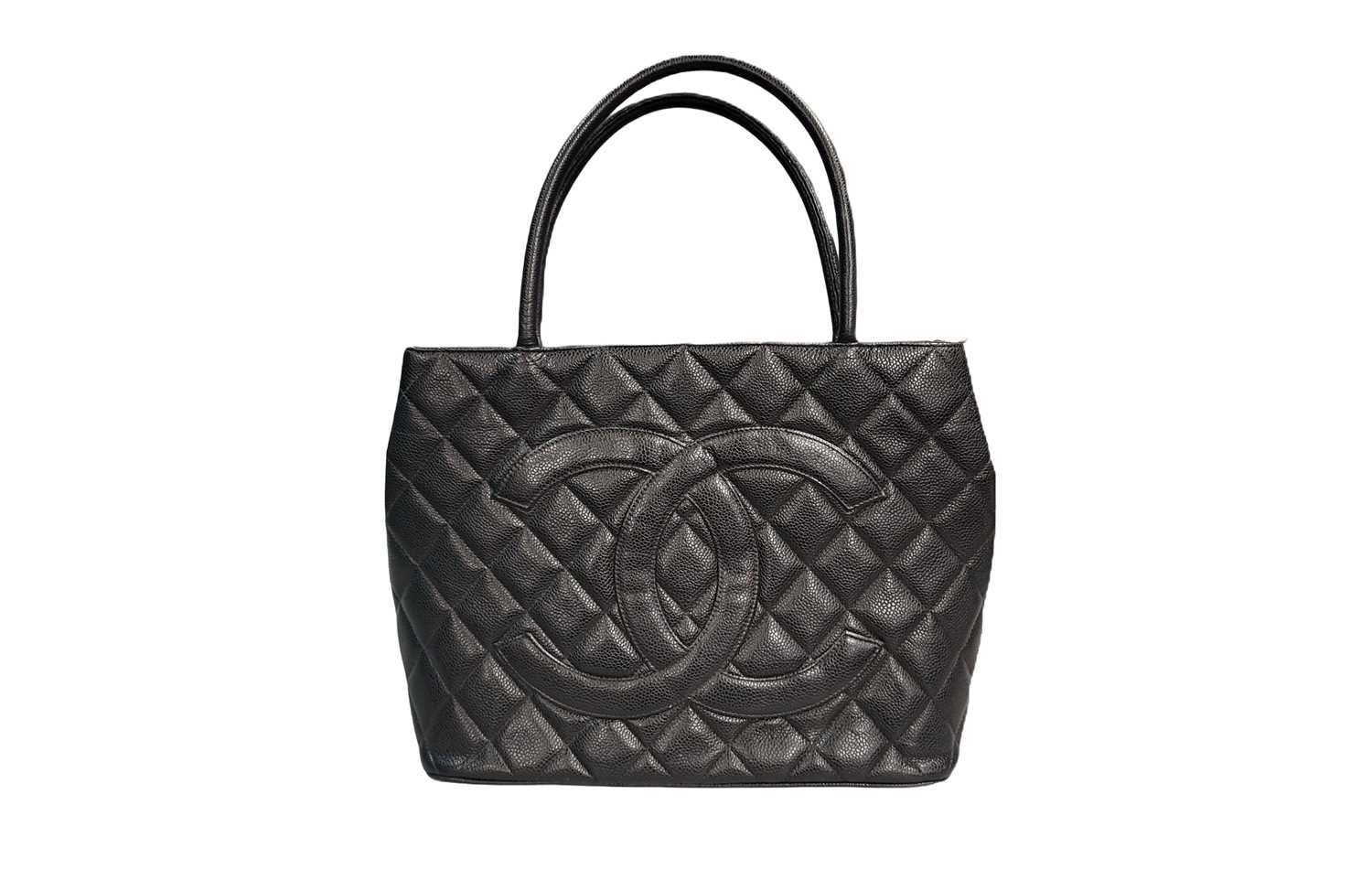Lot 243 - A CHANEL LEATHER MEDALLION TOTE BAG, black...
