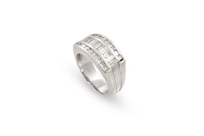 Lot 172 - A DIAMOND THREED ROWED RING, the channel set...
