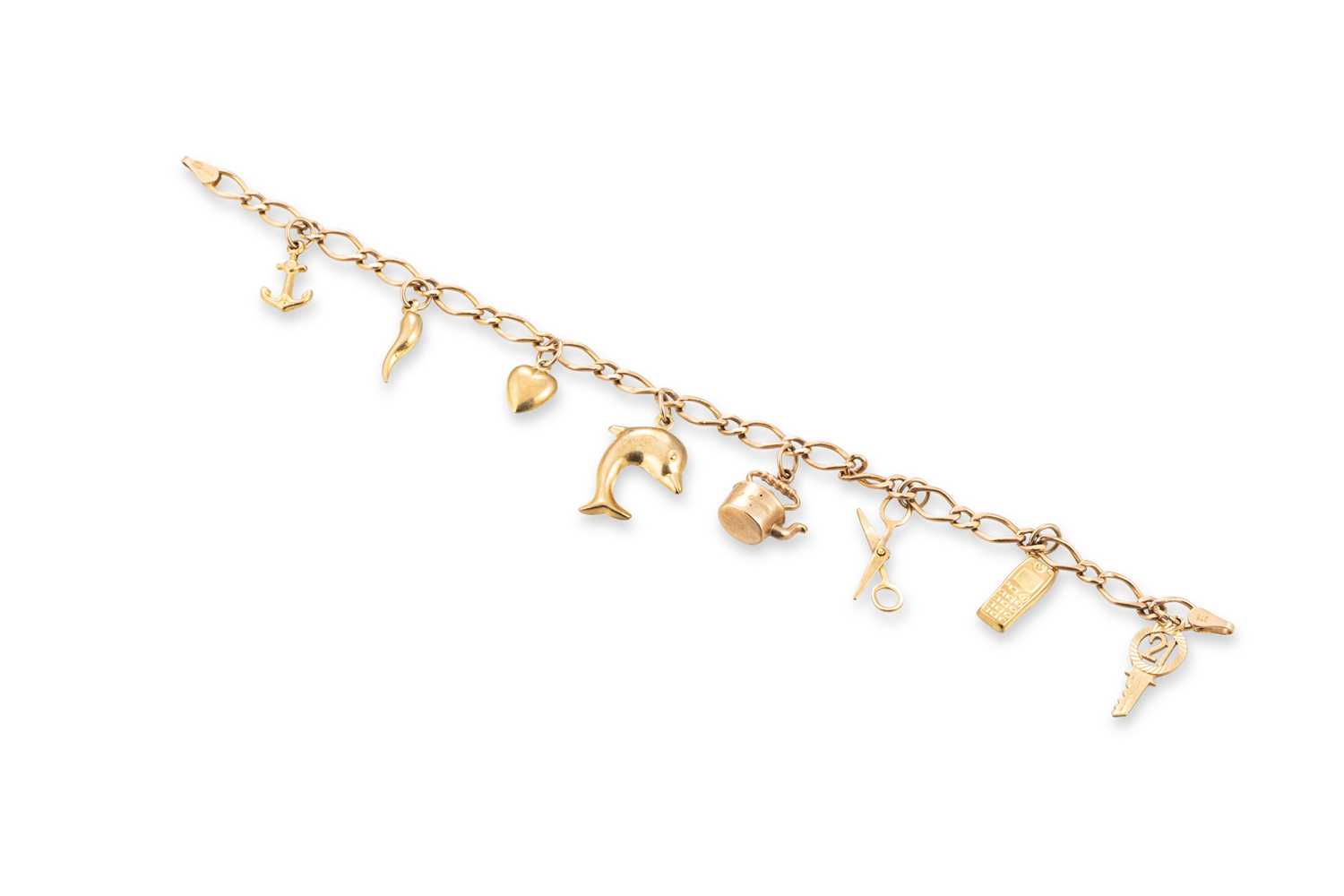 Lot 33 - A MODERN 9CT YELLOW GOLD CHARM BRACELET,...