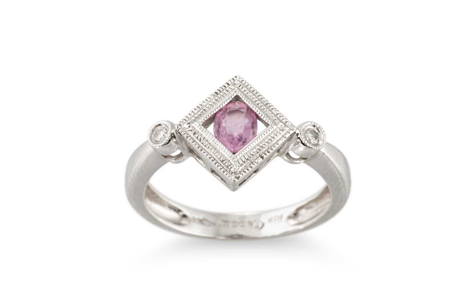 Lot 254 - A PINK SAPPHIRE AND DIAMOND THREE STONE RING,...