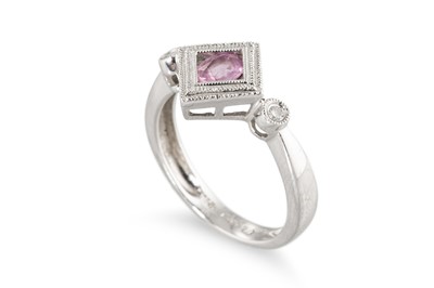 Lot 254 - A PINK SAPPHIRE AND DIAMOND THREE STONE RING,...