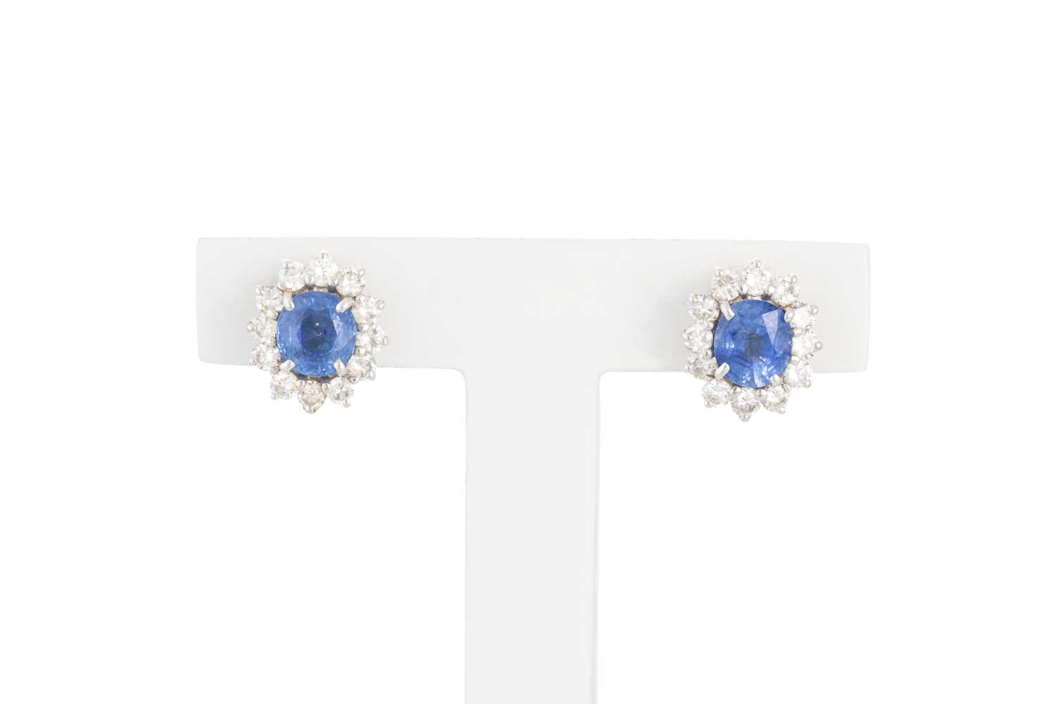 Lot 217 - A PAIR OF DIAMOND AND SAPPHIRE CLUSTER...