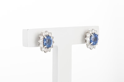 Lot 217 - A PAIR OF DIAMOND AND SAPPHIRE CLUSTER...