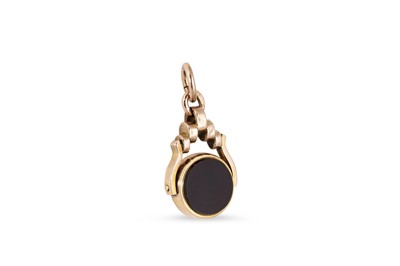 Lot 129 - A VINTAGE GOLD FOB SWIVEL PENDANT, set with...