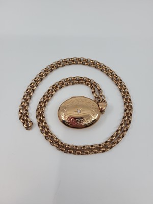 Lot 165 - A 9CT ROSE GOLD LOCKET, set with a diamond on...