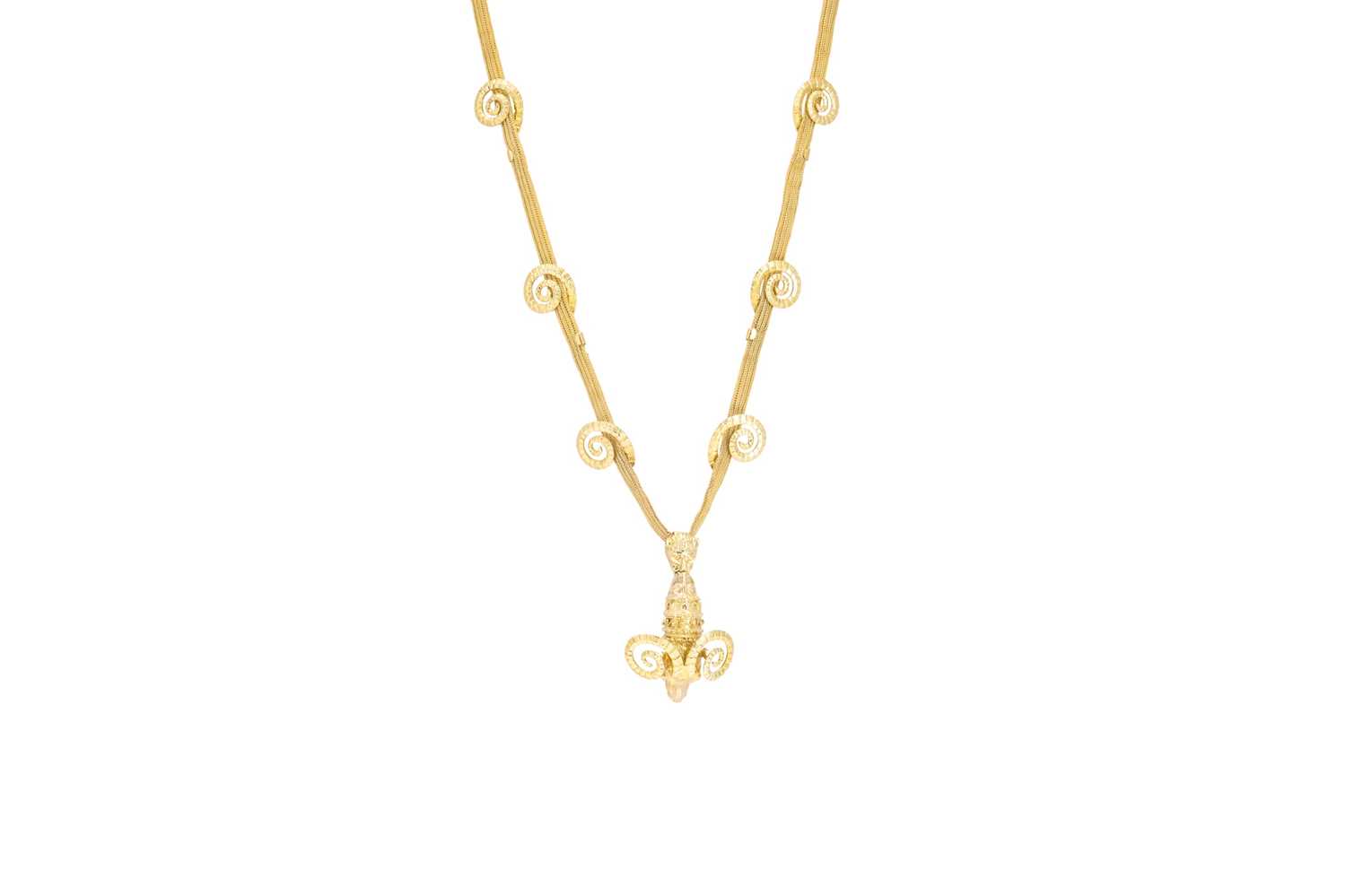 Lot 52 - AN GOLD PENDANT, modelled as a Ram's head,...