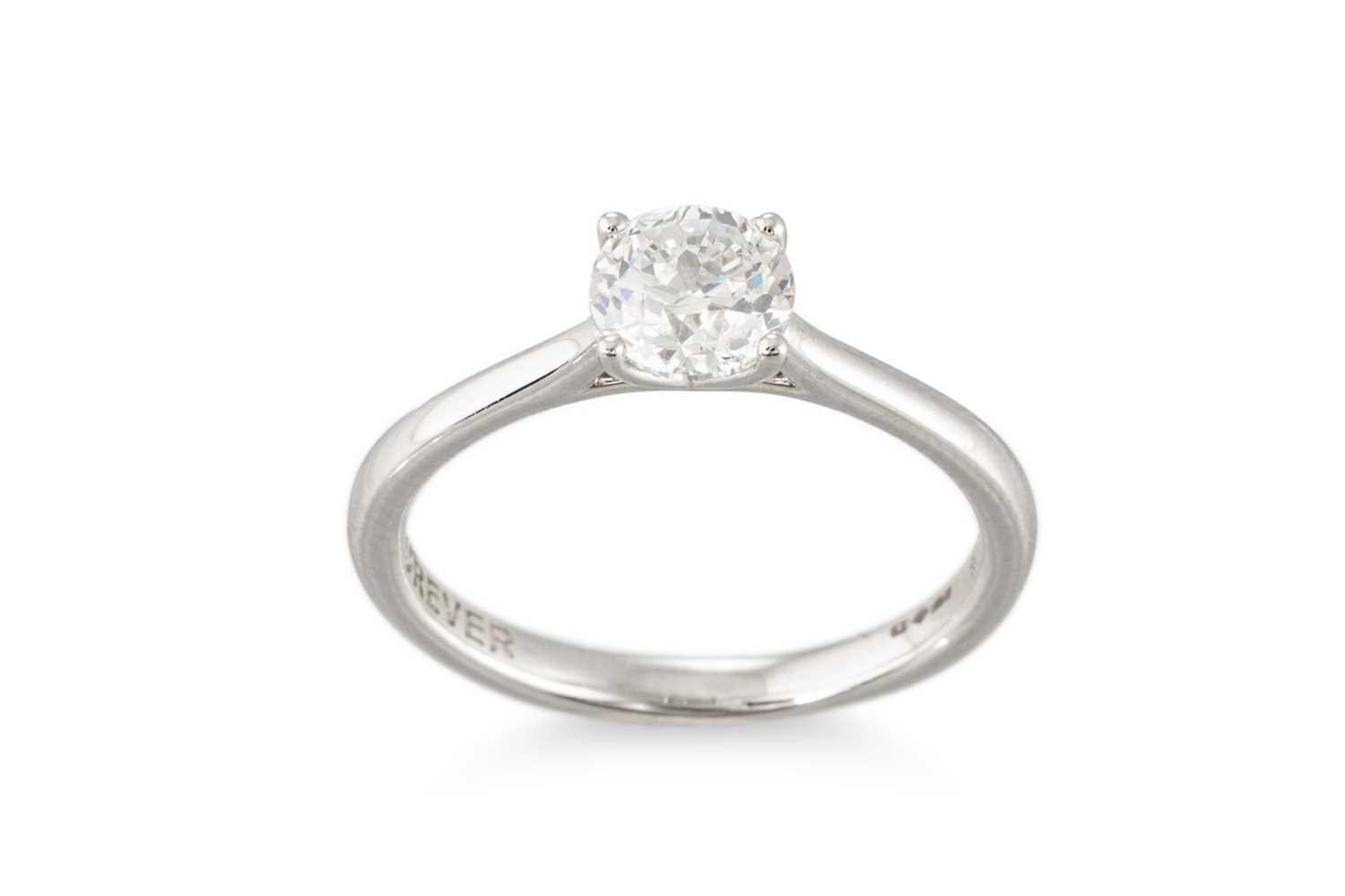 Lot 161 - A DIAMOND SOLITAIRE RING, the diamond mounted...