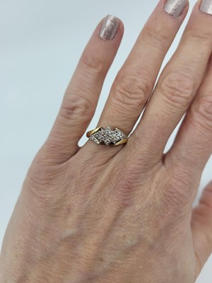 Lot 63 - A DIAMOND CLUSTER RING, lozenge shape, mounted...