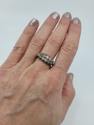 Lot 240 - A DIAMOND SET NAVETTE CLUSTER RING, the old...