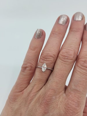 Lot 282 - A DIAMOND SOLITAIRE RING, the marquise cut...