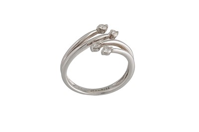 Lot 91 - A DIAMOND RING, of cross over design, mounted...