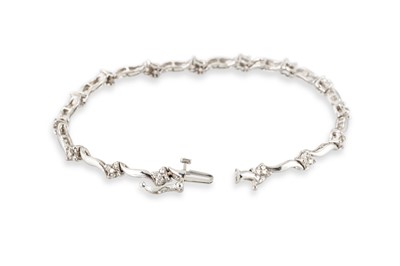 Lot 220 - A DIAMOND SET BRACELET, comprising a series of...