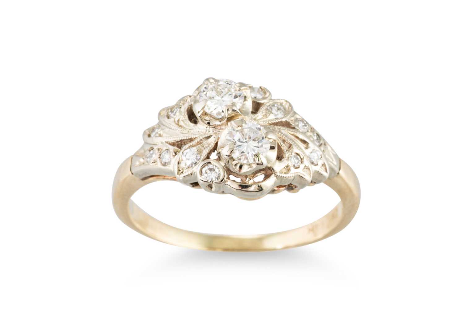 Lot 224 - A DIAMOND CLUSTER RING, set with two principal...