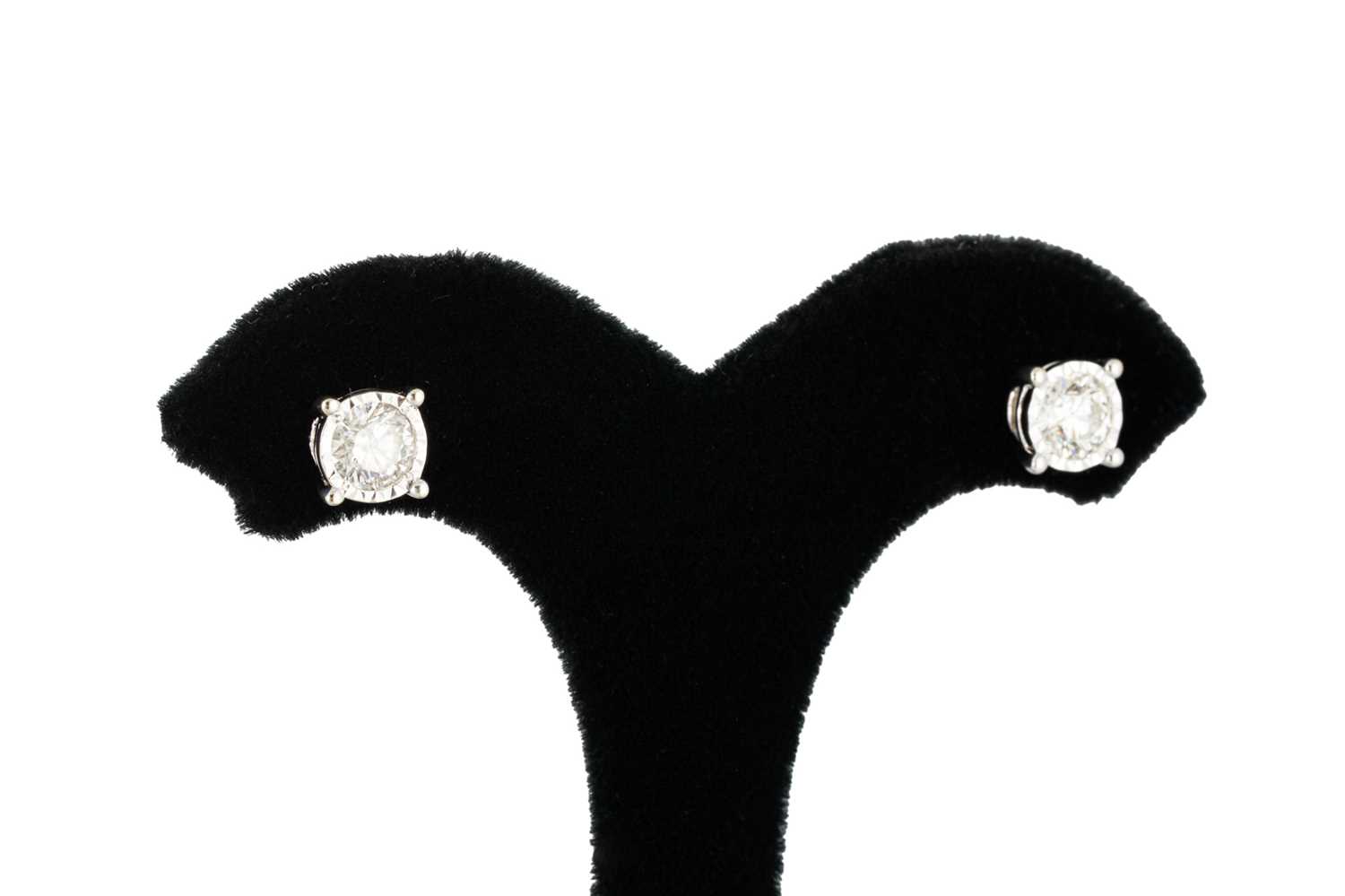 Lot 227 - A PAIR OF DIAMOND STUD EARRINGS, illusion set...