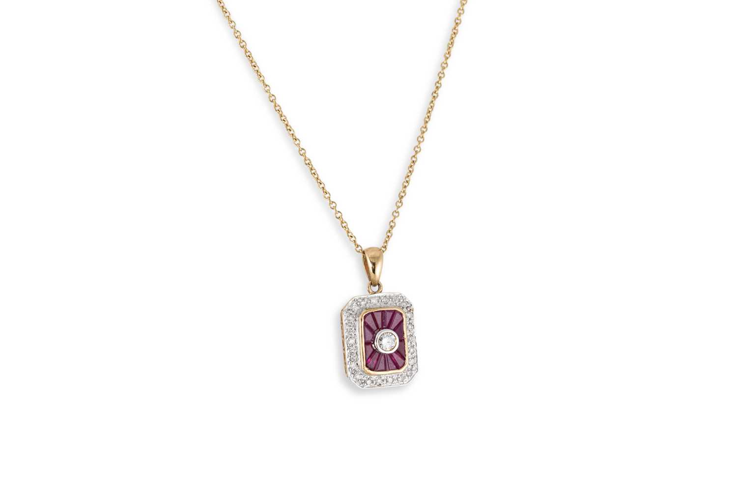 Lot 293 - A RUBY AND DIAMOND CLUSTER PENDANT, mounted in...