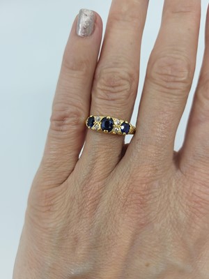 Lot 300 - A VINTAGE SAPPHIRE AND DIAMOND RING, mounted...