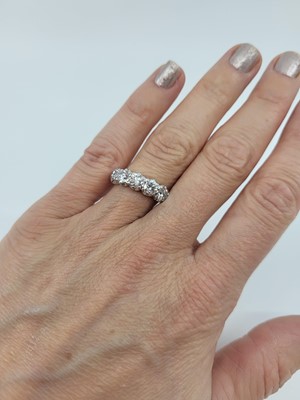 Lot 245 - A DIAMOND FIVE STONE RING, the brilliant cut...
