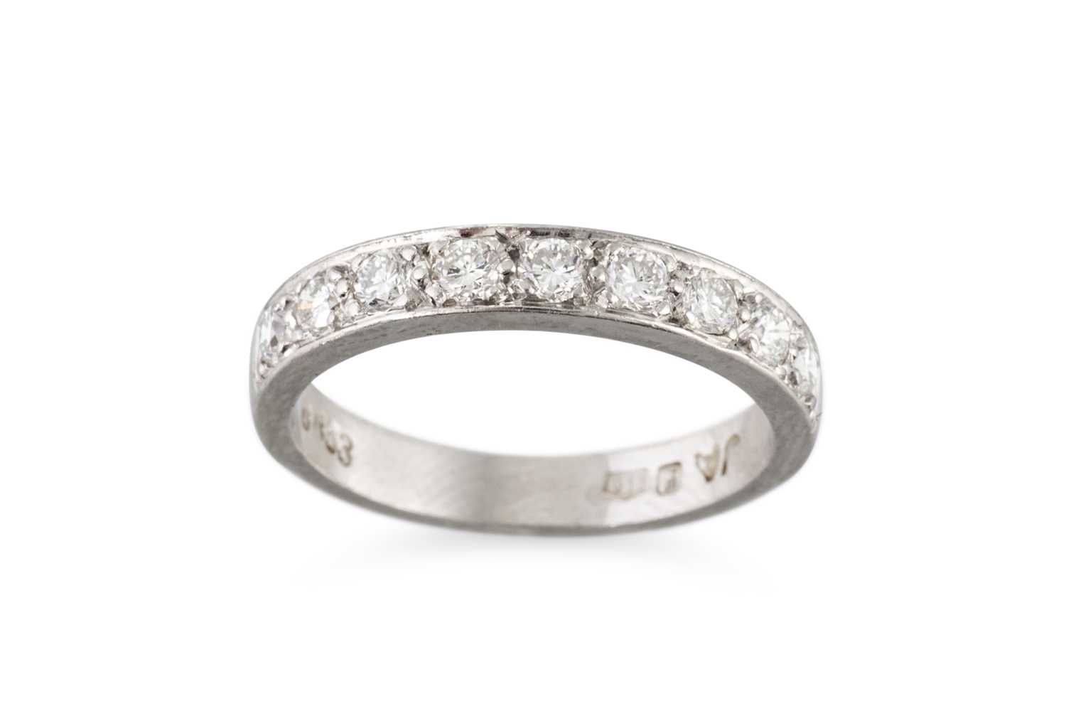 Lot 279 - A DIAMOND HALF ETERNITY RING, the brilliant...