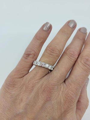 Lot 153 - A DIAMOND FULL BANDED ETERNITY RING, the...