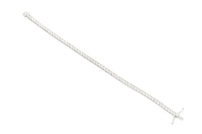 Lot 155 - A DIAMOND LINE BRACELET, the brilliant cut...