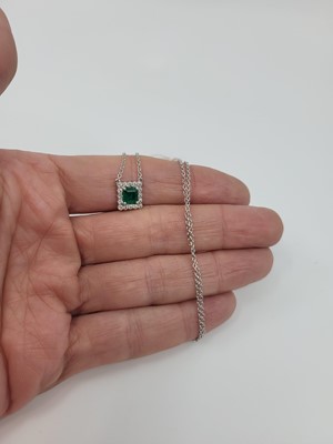 Lot 156 - AN EMERALD AND DIAMOND CLUSTER PENDANT, of...