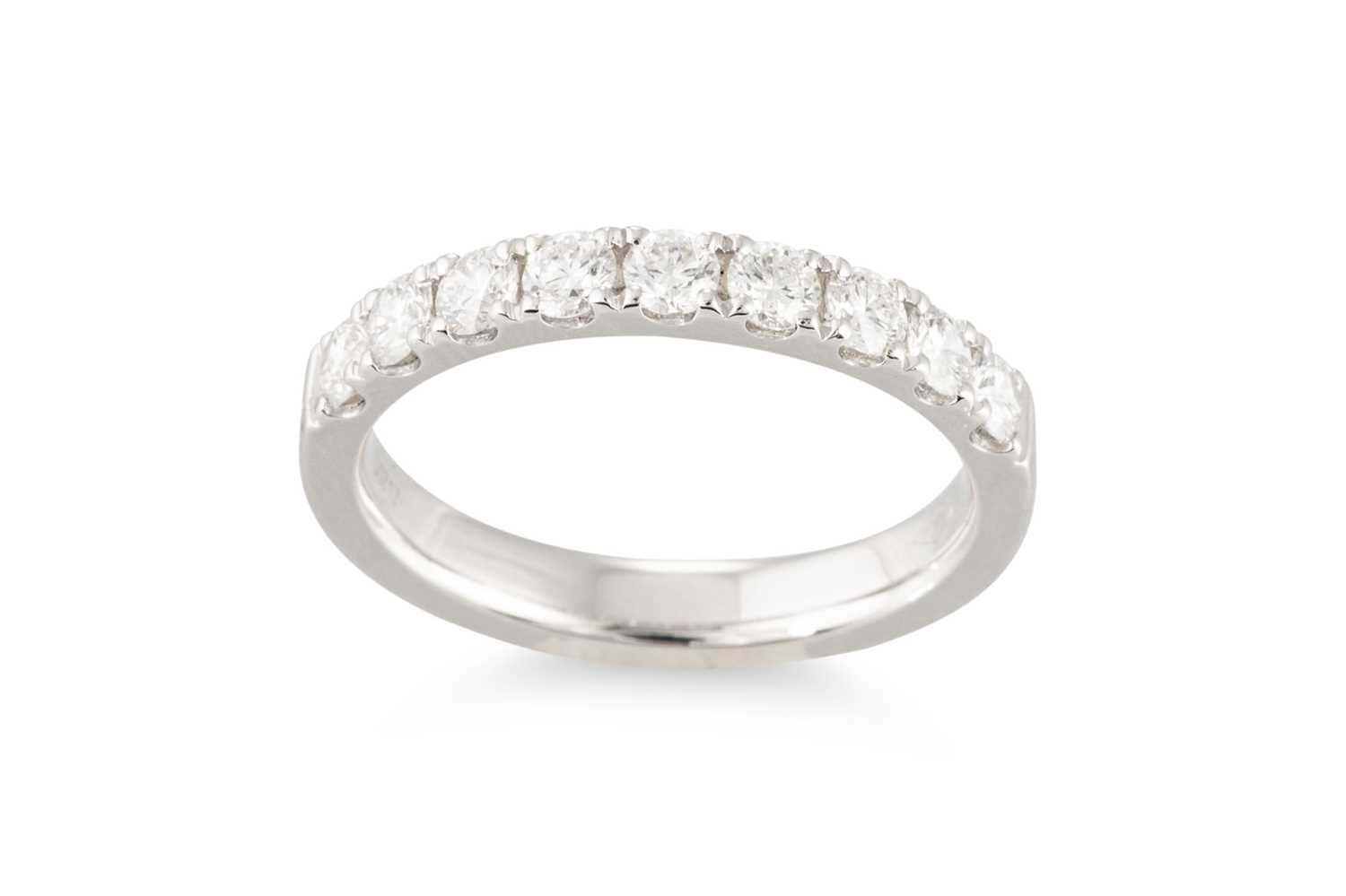 Lot 160 - A DIAMOND HALF ETERNITY RING, the brilliant...