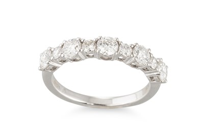 Lot 284 - A DIAMOND BAND RING, set with brilliant cut...
