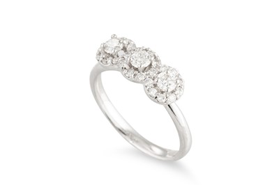Lot 286 - A DIAMOND TRIPLE CLUSTER RING, the brilliant...