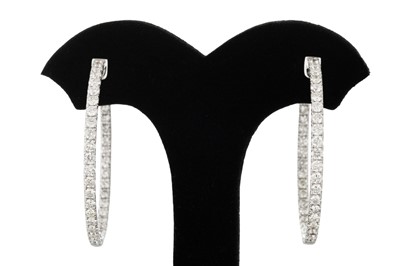 Lot 291 - A PAIR OF DIAMOND HOOP EARRINGS, the diamonds...