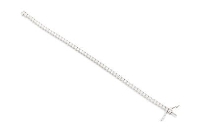 Lot 333 - A DIAMOND LINE BRACELET, the brilliant cut...