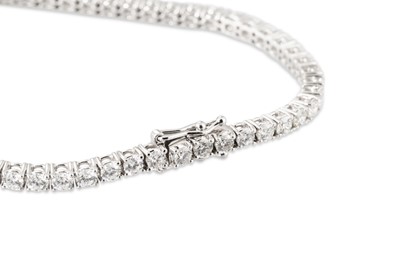 Lot 333 - A DIAMOND LINE BRACELET, the brilliant cut...