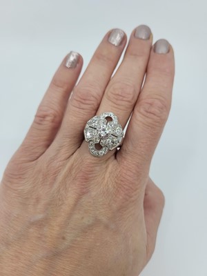 Lot 183 - A DIAMOND PLAQUE STYLE CLUSTER RING, the...