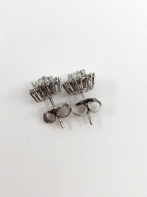 Lot 184 - A PAIR OF DIAMOND CLUSTER EARRINGS, the...