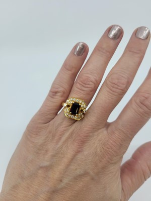 Lot 185 - A SAPPHIRE AND DIAMOND CLUSTER RING,...