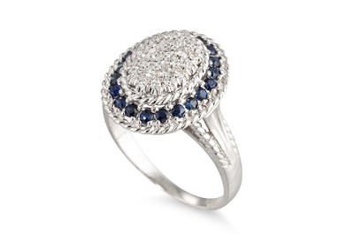 Lot 186 - A PAVÉ DIAMOND AND SAPPHIRE CLUSTER RING,...