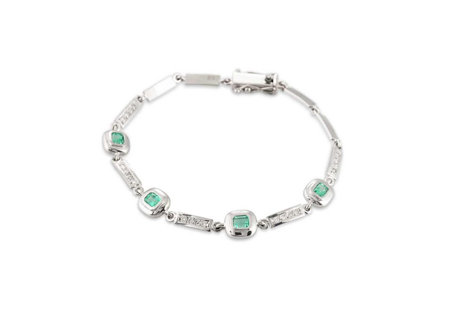 Lot 231 - AN EMERALD AND DIAMOND BRACELET, each...